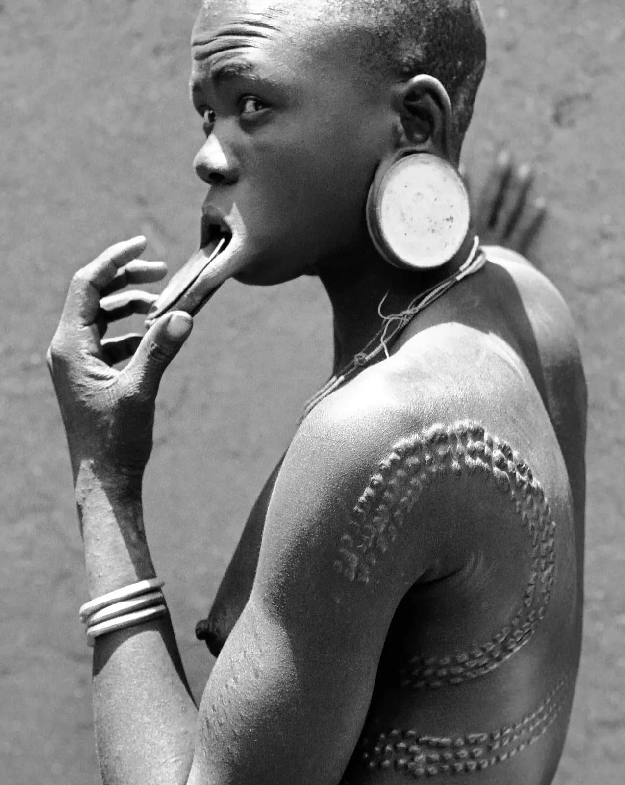 Mursi woman with traditional scarification